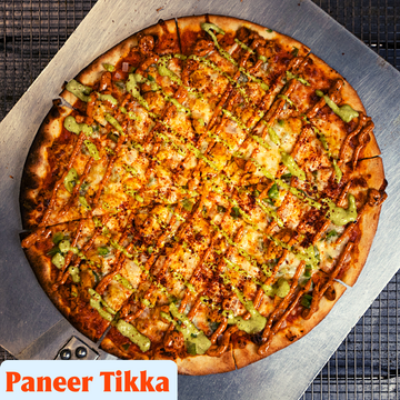 Experience a fusion of Indian and Italian flavors with Nommli's Indian-Style Pizza